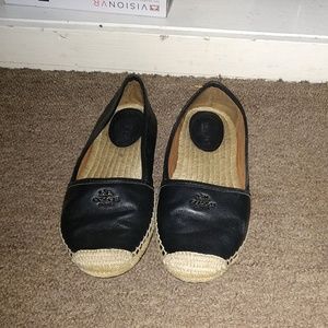 Black and tan coach shoes